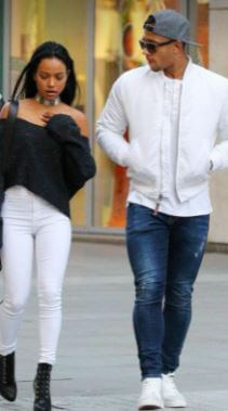Karrueche Tientrese Tran with her rumored boyfriend Memphis Depay walking in the street.